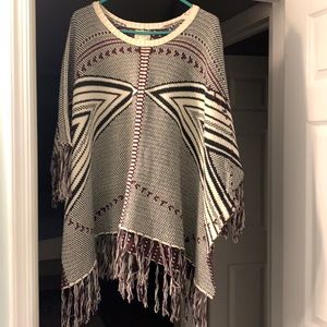 Poncho.  Sweater fringe poncho.  Beige black maroon